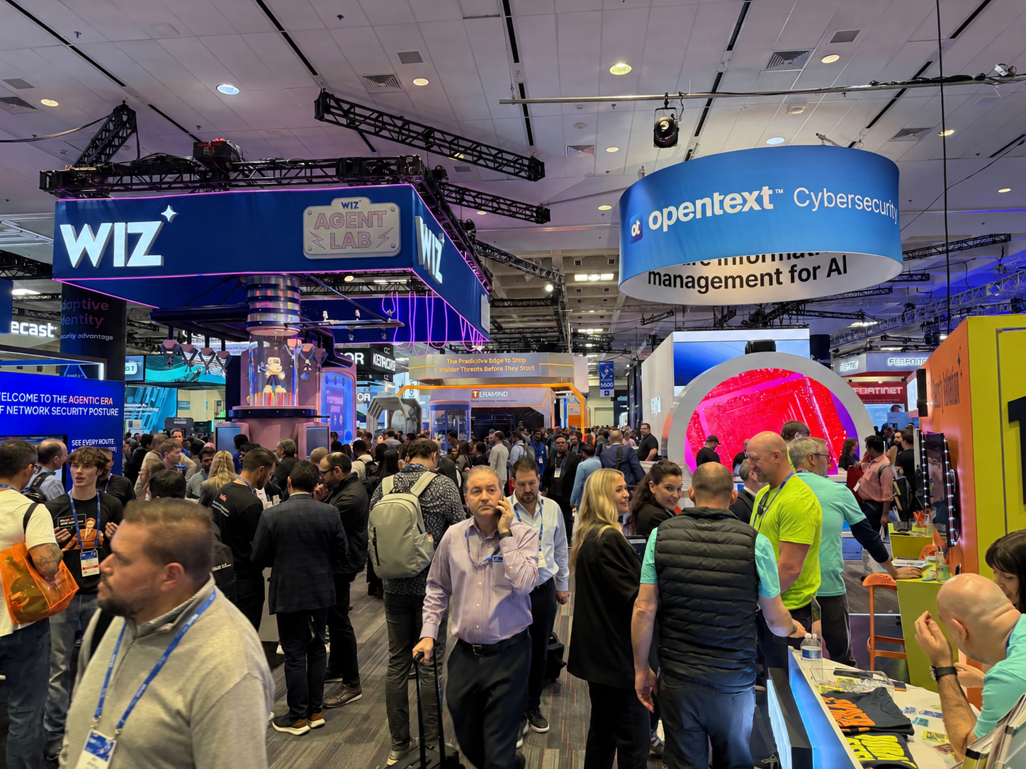 Attendees moving through a busy trade show floor